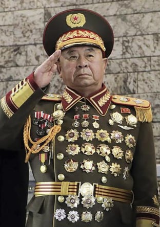 a-heavily-awarded-north-korean-general-salutes-next-to-kim-v0-kkyoq0m505ha1