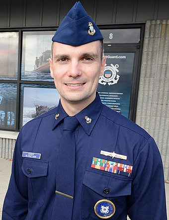 340px-Chief_Petty_Officer_Nick_Scheck_stands_in_front_of_Coast_Guard_Recruiting_Office_Atlantic_City,_New_Jersey